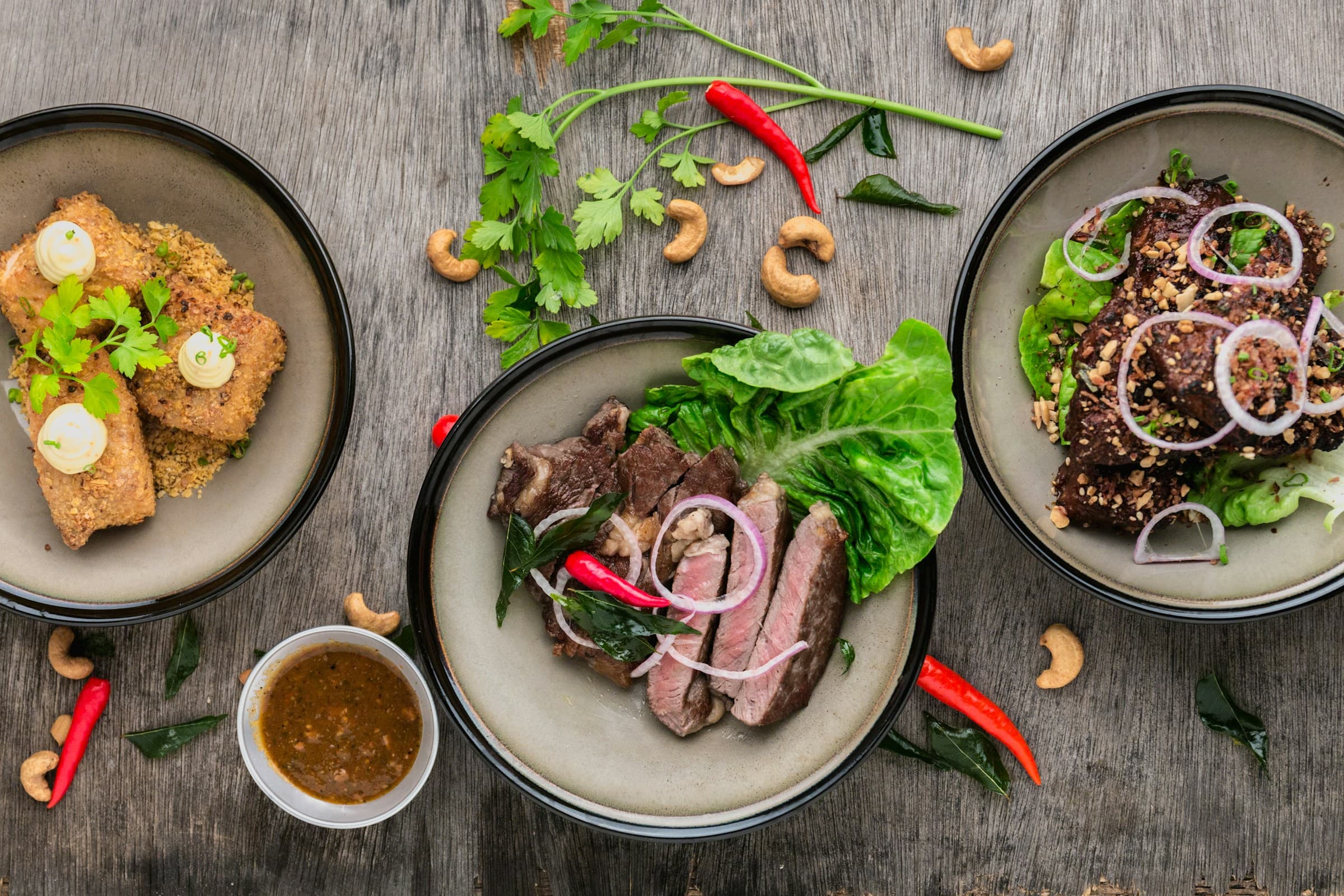 Fresh ingredients arranged on a wooden surface, seen from above